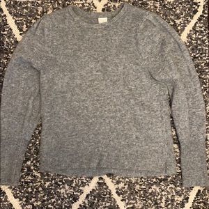 Medium gray sweater.